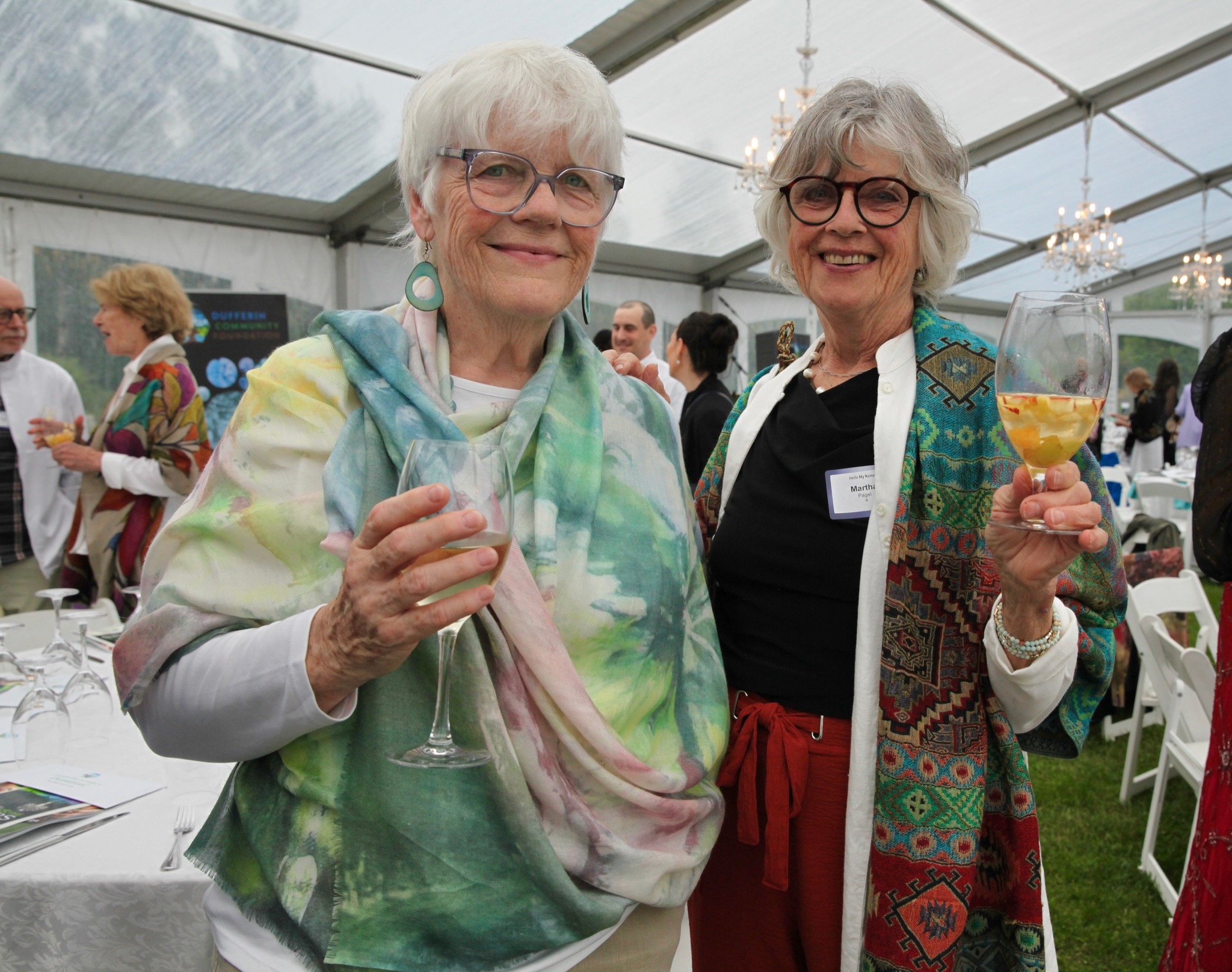 two women with glasses of wine