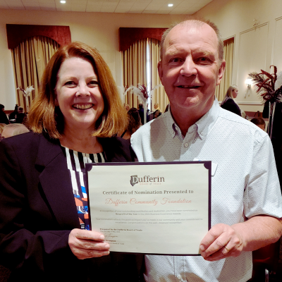 Michele Fisher & Roy Bryan holding Non-Profit Of the Year Nomination